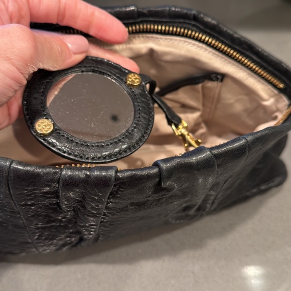 Elegant Black Leather Tory Burch Clutch with Gold Accents